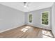 Bright and airy bedroom with hardwood floors and ample natural light at 510 Guy Walker Way, Durham, NC 27703