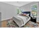 Cozy bedroom with natural light, neutral walls, and stylish decor at 510 Guy Walker Way, Durham, NC 27703