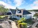 A clubhouse with a wraparound porch and a beautifully landscaped entrance, perfect for community gatherings at 510 Guy Walker Way, Durham, NC 27703