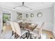 Elegant dining room with hardwood floors, stylish lighting, and seating for six at 510 Guy Walker Way, Durham, NC 27703