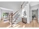 Bright foyer with hardwood floors, staircase, and decorative details at 510 Guy Walker Way, Durham, NC 27703
