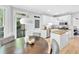 Eat-in kitchen with granite counters, stainless appliances, and white cabinetry at 510 Guy Walker Way, Durham, NC 27703