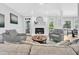 Cozy living room featuring fireplace, modern decor, and plenty of natural light at 510 Guy Walker Way, Durham, NC 27703