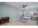 Bedroom featuring a ceiling fan, neutral paint and carpet, and two windows offering natural light at 5315 Oakbrook Dr, Durham, NC 27713