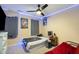 Bedroom with a ceiling fan, led lights, carpet, and decorated walls at 5315 Oakbrook Dr, Durham, NC 27713