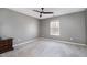 Bedroom featuring a ceiling fan, neutral paint and carpet, and one window offering natural light at 5315 Oakbrook Dr, Durham, NC 27713
