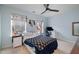 Bedroom featuring a ceiling fan, neutral paint and carpet, and two windows offering natural light at 5315 Oakbrook Dr, Durham, NC 27713