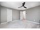 Neutral bedroom features a ceiling fan, carpet floors, and white doors at 5315 Oakbrook Dr, Durham, NC 27713