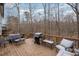 Spacious wooden deck with a grill and furniture, perfect for entertaining at 5315 Oakbrook Dr, Durham, NC 27713