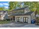 Traditional two-story home featuring neutral siding, a brick facade, and a basketball hoop for outdoor fun at 5315 Oakbrook Dr, Durham, NC 27713