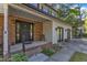 Charming front porch with brick accents and a cozy seating area, creating a welcoming entry to the home at 5315 Oakbrook Dr, Durham, NC 27713