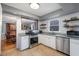 Bright kitchen featuring white cabinets, stainless steel appliances, and granite countertops at 5315 Oakbrook Dr, Durham, NC 27713
