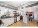 Open concept kitchen with granite countertops, stainless steel appliances, and an island with bar seating at 5315 Oakbrook Dr, Durham, NC 27713