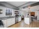Spacious kitchen with white cabinets, stainless appliances, and island open to the living room at 5315 Oakbrook Dr, Durham, NC 27713