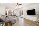 Bright living room open to kitchen, featuring French doors to deck, and hardwood floors at 5315 Oakbrook Dr, Durham, NC 27713