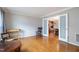 A sitting room, featuring an ornate doorway and hardwood floors at 5315 Oakbrook Dr, Durham, NC 27713