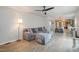 Cozy living room with hardwood floors, an ottoman and access to the kitchen at 5315 Oakbrook Dr, Durham, NC 27713