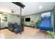 Open concept living room offers wood floors, a ceiling fan, and a basketball game at 5315 Oakbrook Dr, Durham, NC 27713