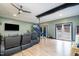 Open concept living room with wood floors, sliding glass doors, and green walls at 5315 Oakbrook Dr, Durham, NC 27713