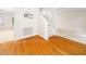 Bright entrance featuring gleaming hardwood floors, stairs, and access to other rooms at 5504 Cumberland Plain Dr, Raleigh, NC 27616