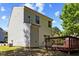 Rear exterior view of home from the backyard with a wooden deck and small garden at 5801 Forest Point Rd, Raleigh, NC 27610