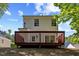 The backyard has a wooden deck that is perfect for entertaining and relaxing at 5801 Forest Point Rd, Raleigh, NC 27610