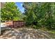 Backyard view with wooden deck, perfect for outdoor enjoyment and relaxation at 5801 Forest Point Rd, Raleigh, NC 27610