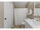 Modern bathroom featuring a white vanity, updated fixtures, and a shower with curtain at 5801 Forest Point Rd, Raleigh, NC 27610