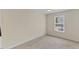 Bedroom with carpet, ceiling fan, and window at 5801 Forest Point Rd, Raleigh, NC 27610