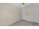 Neutral bedroom with a ceiling fan and two doors at 5801 Forest Point Rd, Raleigh, NC 27610
