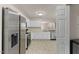 Spacious kitchen boasts stainless steel appliances, white cabinets, and great natural light at 5801 Forest Point Rd, Raleigh, NC 27610