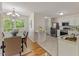 Bright kitchen and dining area featuring stainless steel appliances and natural light at 5801 Forest Point Rd, Raleigh, NC 27610
