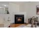 Cozy living room showcasing a fireplace and hardwood flooring at 5801 Forest Point Rd, Raleigh, NC 27610