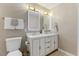 Elegant main bathroom featuring a double vanity, modern mirrors, and stylish gold hardware at 5801 Forest Point Rd, Raleigh, NC 27610