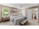 Serene main bedroom boasts large windows, a ceiling fan, and an ensuite bathroom at 5801 Forest Point Rd, Raleigh, NC 27610