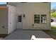 View of the backyard patio through the back door, showing a small garden at 5801 Forest Point Rd, Raleigh, NC 27610