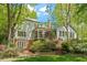 Spacious backyard featuring a well-maintained lawn, brick patio, and ample space for outdoor activities at 605 Glen Eden Dr, Raleigh, NC 27612