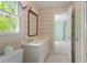 Bathroom featuring striped wallpaper, a white vanity, and a view into an adjoining bedroom at 605 Glen Eden Dr, Raleigh, NC 27612