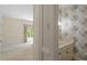 Bedroom view featuring an attached bathroom with floral wallpaper and vanity at 605 Glen Eden Dr, Raleigh, NC 27612