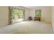 Bedroom featuring carpet floors, a large window, and floral curtains at 605 Glen Eden Dr, Raleigh, NC 27612
