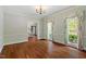 Elegant dining room with hardwood floors, large windows, and natural light, perfect for Gathering gatherings at 605 Glen Eden Dr, Raleigh, NC 27612