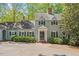Charming two-story home with manicured landscaping and a welcoming front entrance at 605 Glen Eden Dr, Raleigh, NC 27612