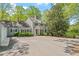 Beautiful home featuring mature trees, manicured shrubs, and traditional architecture at 605 Glen Eden Dr, Raleigh, NC 27612