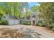 Inviting home with a two-car garage, well-maintained landscaping, and classic architectural details at 605 Glen Eden Dr, Raleigh, NC 27612