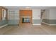 A brick fireplace sits between built in shelves with lots of room for Gathering activities at 605 Glen Eden Dr, Raleigh, NC 27612
