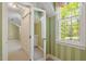 Upstairs hallway with natural light, closet and hallway view to the bathroom at 605 Glen Eden Dr, Raleigh, NC 27612