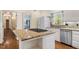 Spacious kitchen with granite island, stainless steel appliances, and ample cabinet space at 605 Glen Eden Dr, Raleigh, NC 27612