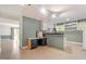 This living room features a combination desk and bar area with built-in cabinets and white appliances at 605 Glen Eden Dr, Raleigh, NC 27612