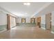 A large living area with a brick fireplace, windows and french doors for lots of light at 605 Glen Eden Dr, Raleigh, NC 27612