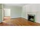 Elegant living room with hardwood floors, fireplace, and crown molding, ideal for relaxation and gatherings at 605 Glen Eden Dr, Raleigh, NC 27612